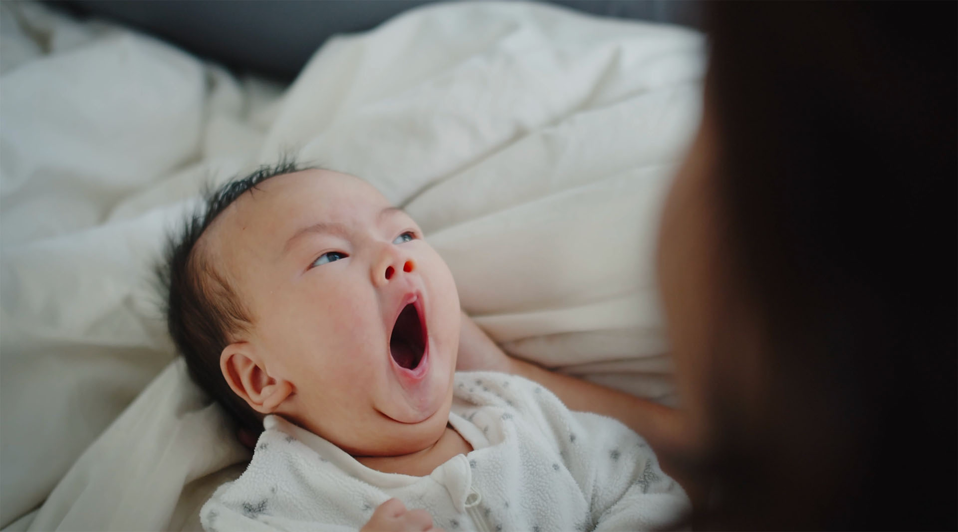 Newborn yawning - Nannies by Noa - New York & Tri-State Area Nanny Agency - Newborn Care - Nannying Jobs Near Me