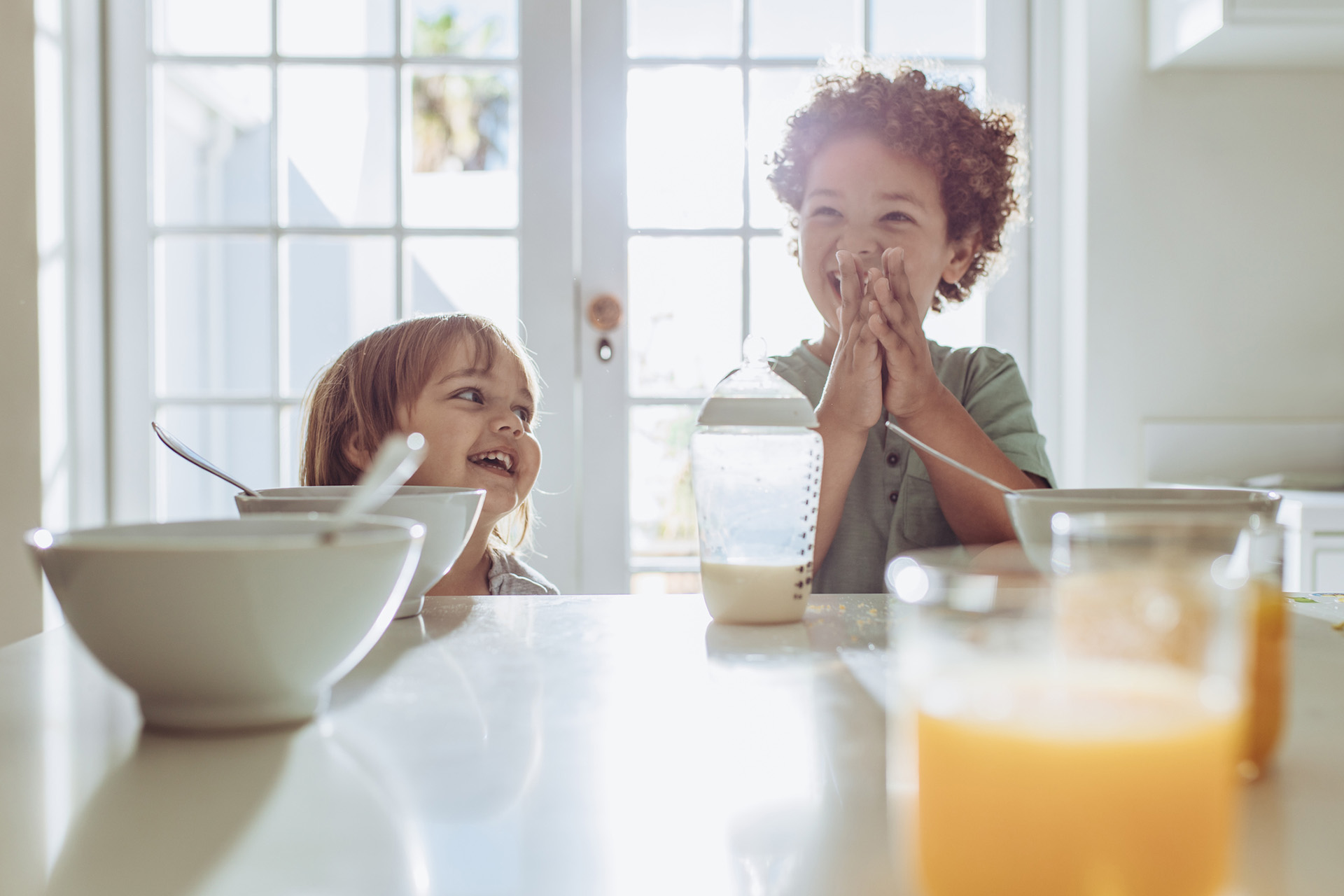 Excited kids at breakfast - Nannies by Noa - New York & Tri-State Area Nanny Agency - Newborn Care - Nannying Jobs Near Me