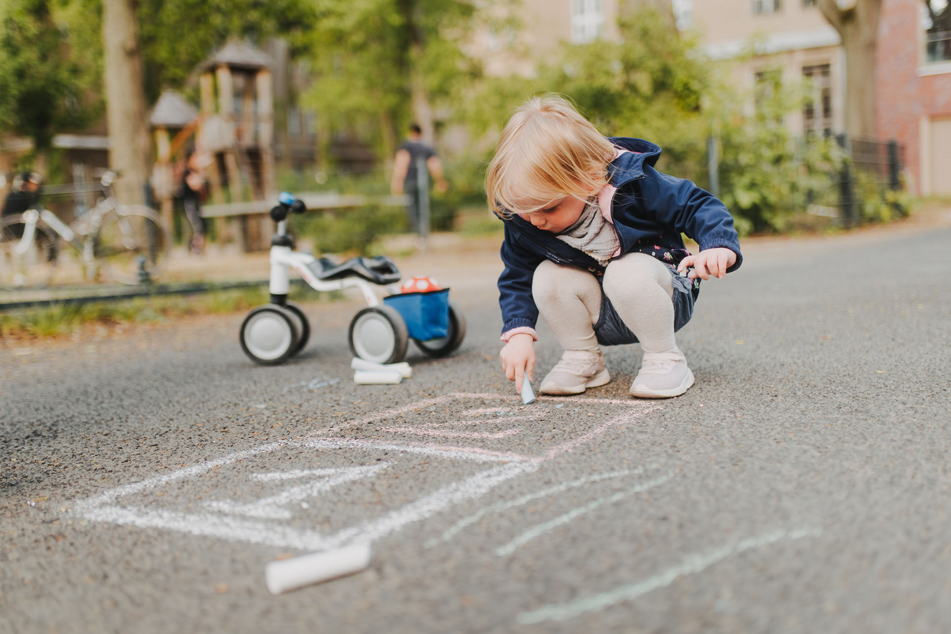 child playing with chalk in NYC - Nannies by Noa - New York & Tri-State Area Nanny Agency - Newborn Care - Nannying Jobs Near Me