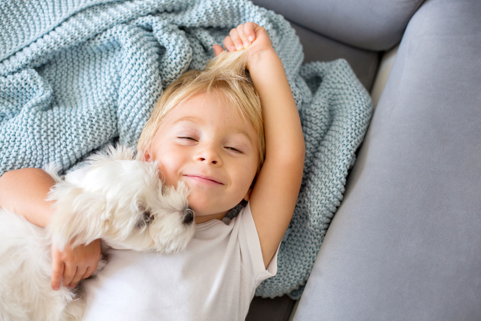 Child with dog in NYC - Nannies by Noa - New York & Tri-State Area Nanny Agency - Newborn Care - Nannying Jobs Near Me