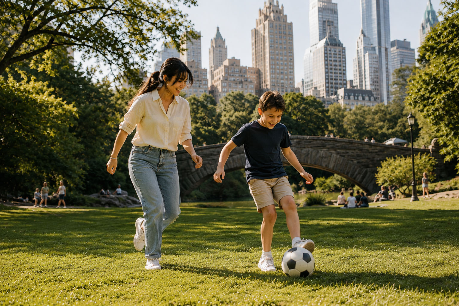 Professional New York City nanny playing soccer with a child in Central Park